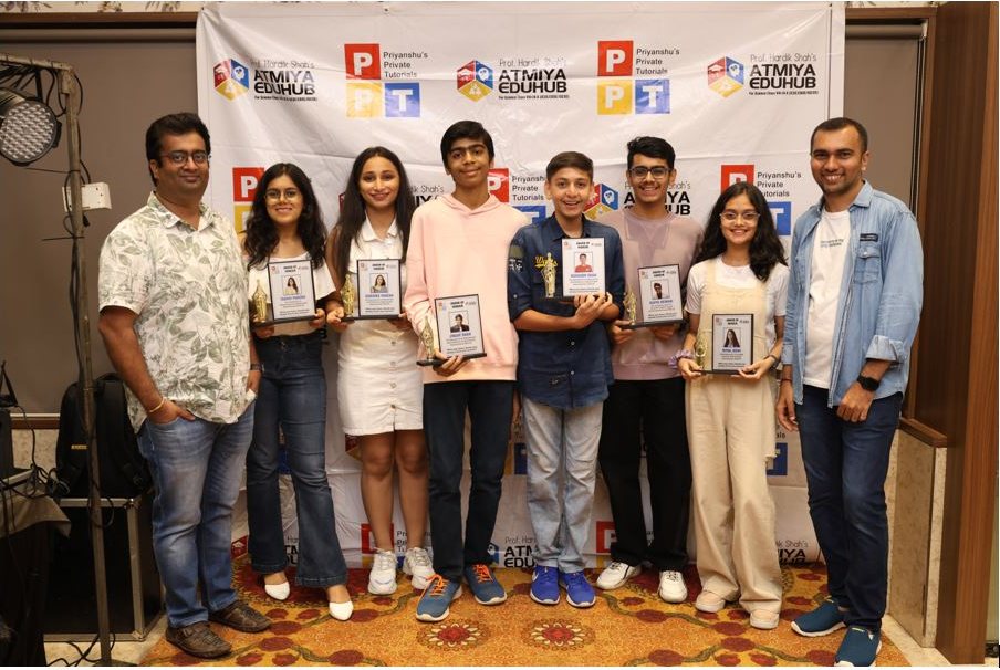 Prof. Priyanshu Shah and Prof. Hardik Shah with award-winning students at the PPT and Atmiya Eduhub felicitation